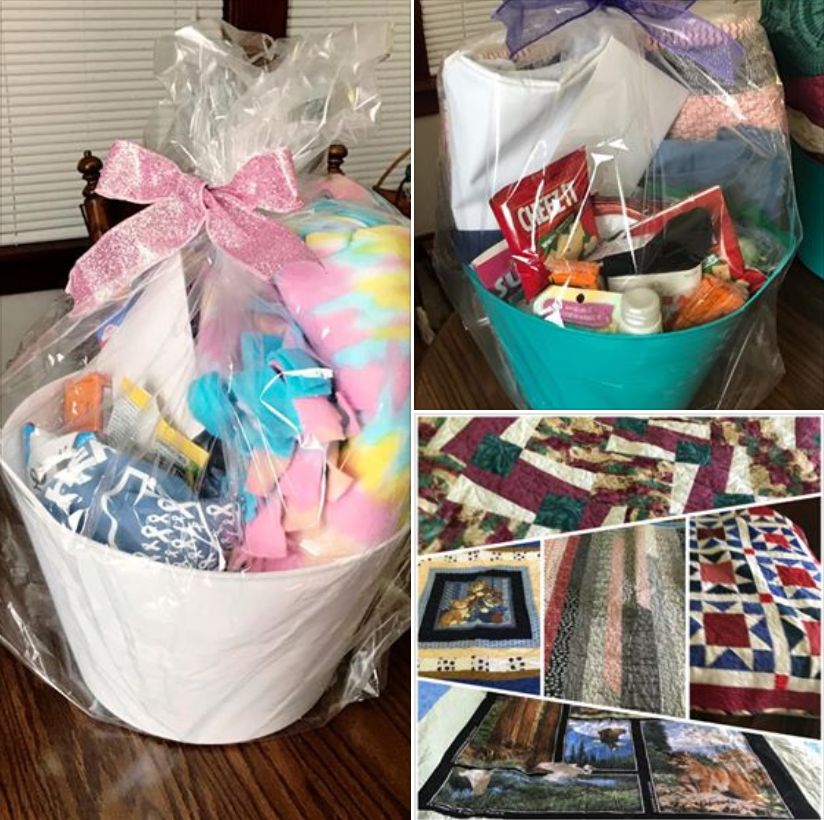 white basket and green basket, each filled with colorful blanket or quilt, blue LRCF tee shirt, bags of snacks, body care products